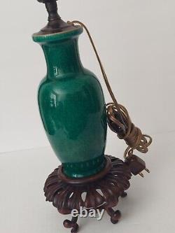 Antique Chinese Green Glazed Porcelain Lamp withCarved Wooden Base 19th Century